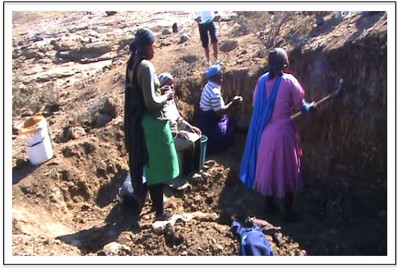 Figure 2. Women extracting clay (clay source 1): in the upper UThukela (photograph taken in 2012, by A.C. Nxumalo).